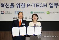 Two people - men and women standing, showcasing certificates